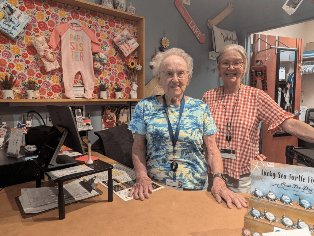 Volunteers Anita Mills and Manager Phyllis Johannes