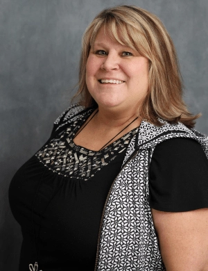 Monica Slagle blue backdrop Headshot