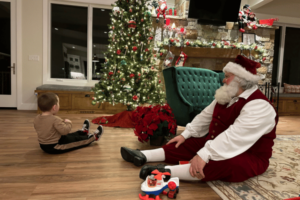 Sensory Santa plays with child and plane_2023