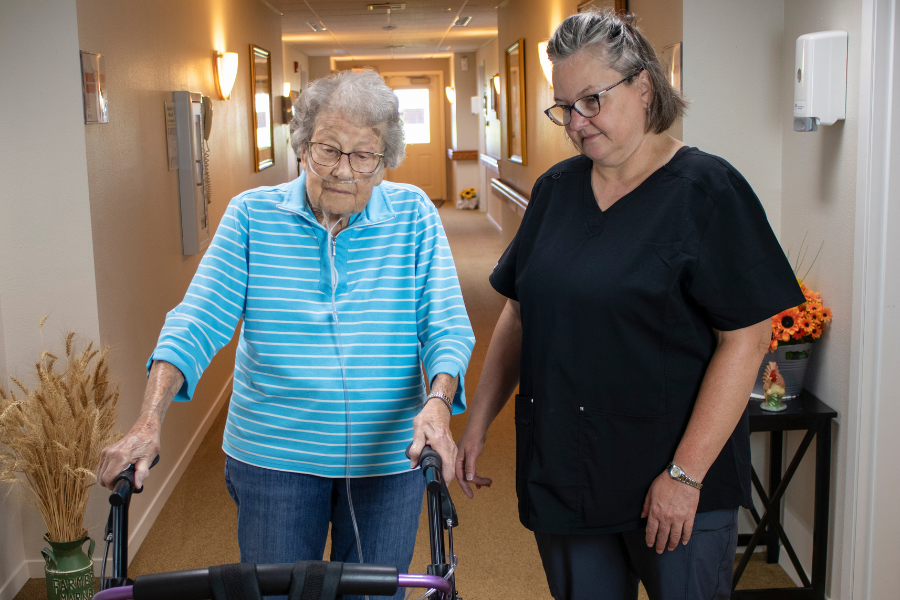 Chester Assisted Living - walking with a patient