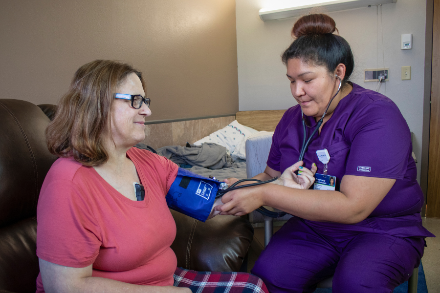 Shelby Care Center - taking blood pressure