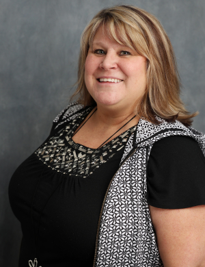 Monica Slagle_Foundation Monica Slagle blue backdrop Headshot